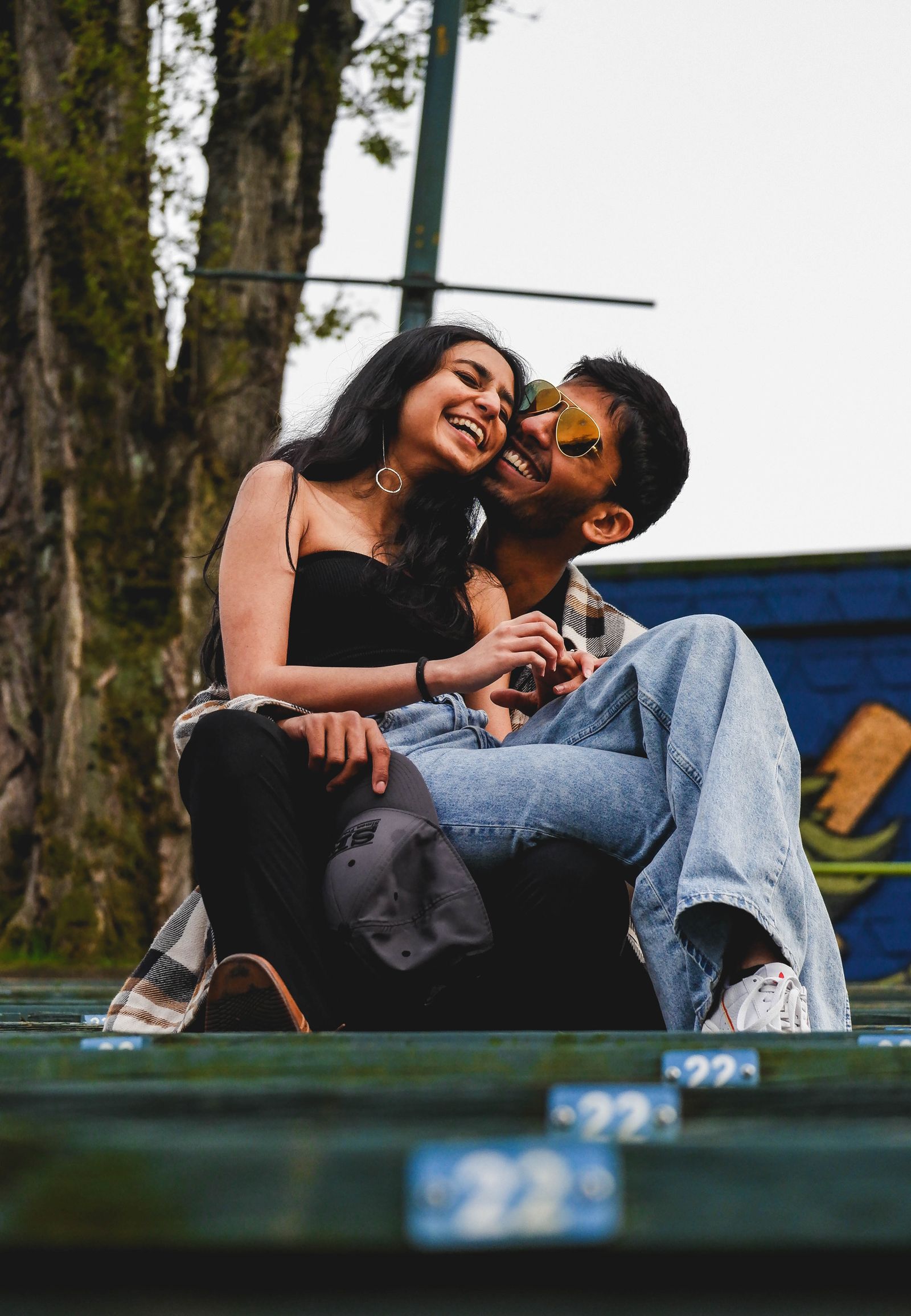Happy couple laughing together outdoors